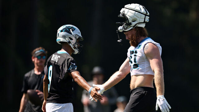 SPARTANBURG, SOUTH CAROLINA - JULY 27: Bryce Young #9 and Hayden Hurst #81 of the Carolina Panthers react during Carolina Panthers Training Camp at Wofford College on July 27, 2023 in Spartanburg, South Carolina.