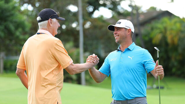 HONOLULU, HAWAII - JANUARY 09: Gary Woodland of the United States shakes hands with Andy North on the 10th green during a practice round prior to the Sony Open in Hawaii at Waialae Country Club on January 09, 2024 in Honolulu, Hawaii.