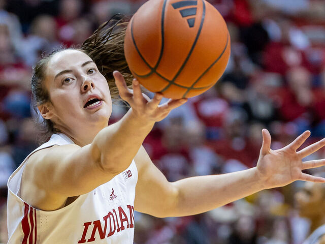 BLOOMINGTON, INDIANA - JANUARY 10: Mackenzie Holmes #54 of the Indiana Hoosiers reaches for the ball during the second half against the Penn State Nittany Lions at Simon Skjodt Assembly Hall on January 10, 2024 in Bloomington, Indiana.