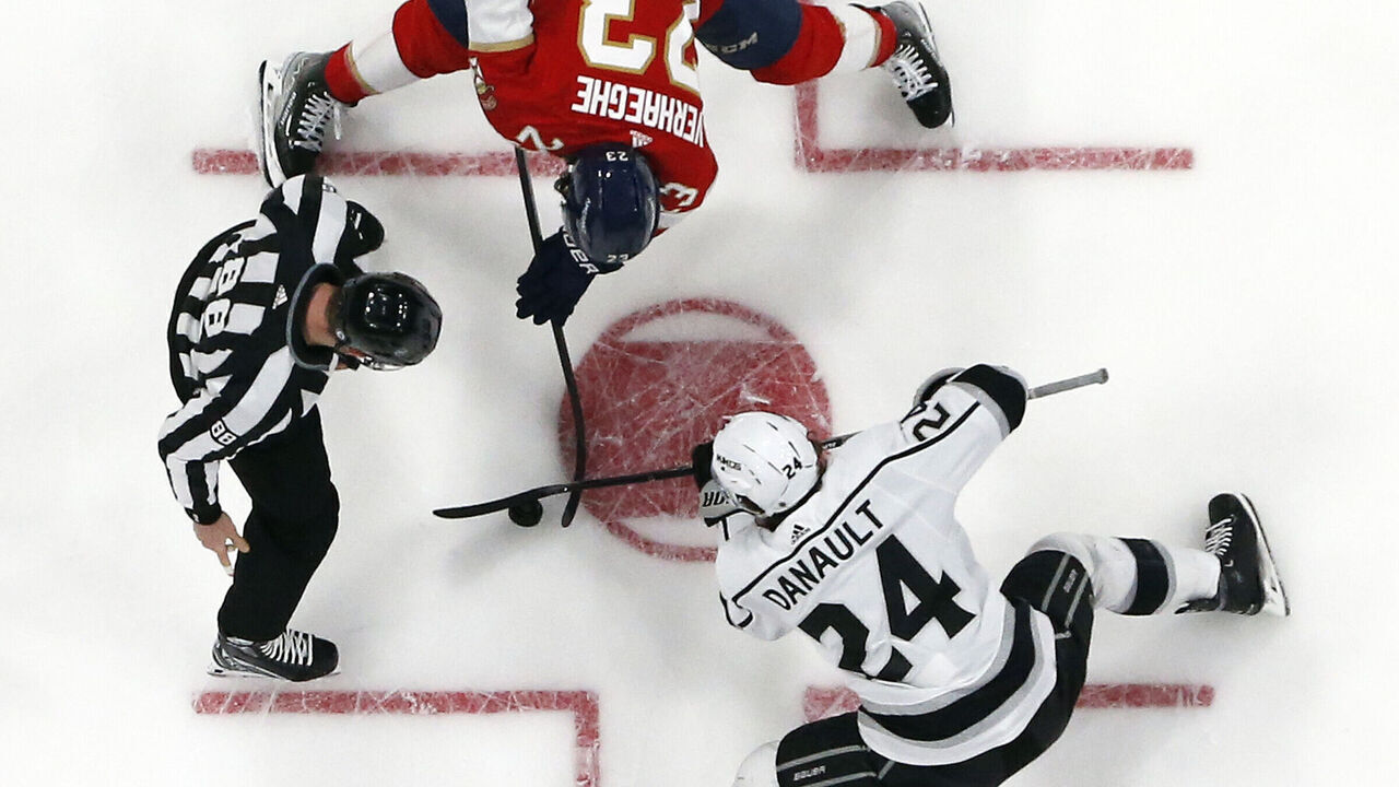 SUNRISE, FL - JANUARY 27: Linesman Tyson Baker #88 drops the puck between Phillip Danault #24 of the Los Angeles Kings and Carter Verhaeghe #23 of the Florida Panthers at the FLA Live Arena on January 27, 2023 in Sunrise, Florida.