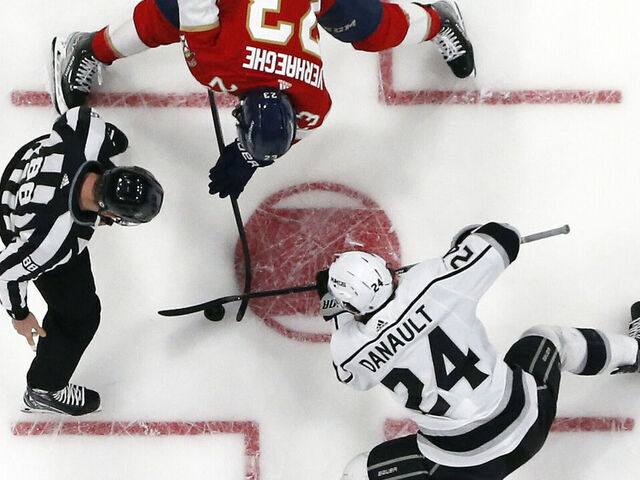 SUNRISE, FL - JANUARY 27: Linesman Tyson Baker #88 drops the puck between Phillip Danault #24 of the Los Angeles Kings and Carter Verhaeghe #23 of the Florida Panthers at the FLA Live Arena on January 27, 2023 in Sunrise, Florida.