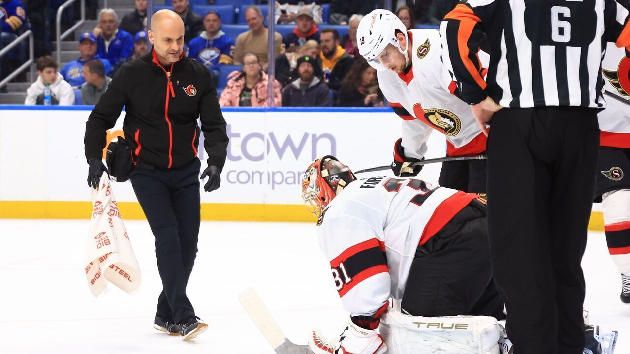 BUFFALO, NEW YORK - JANUARY 11: Anton Forsberg #31 of the Ottawa Senators is tended to after being injured during an NHL game against the Buffalo Sabres on January 11, 2024 at KeyBank Center in Buffalo, New York.