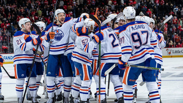 DETROIT, MI - JANUARY 11: Darnell Nurse (25) of the Edmonton Oilers celebrates his game winning overtime goal with teammates against the Detroit Red Wings at Little Caesars Arena on January 11, 2024 in Detroit, Michigan. Edmonton defeated Detroit in O.T. 3-2.