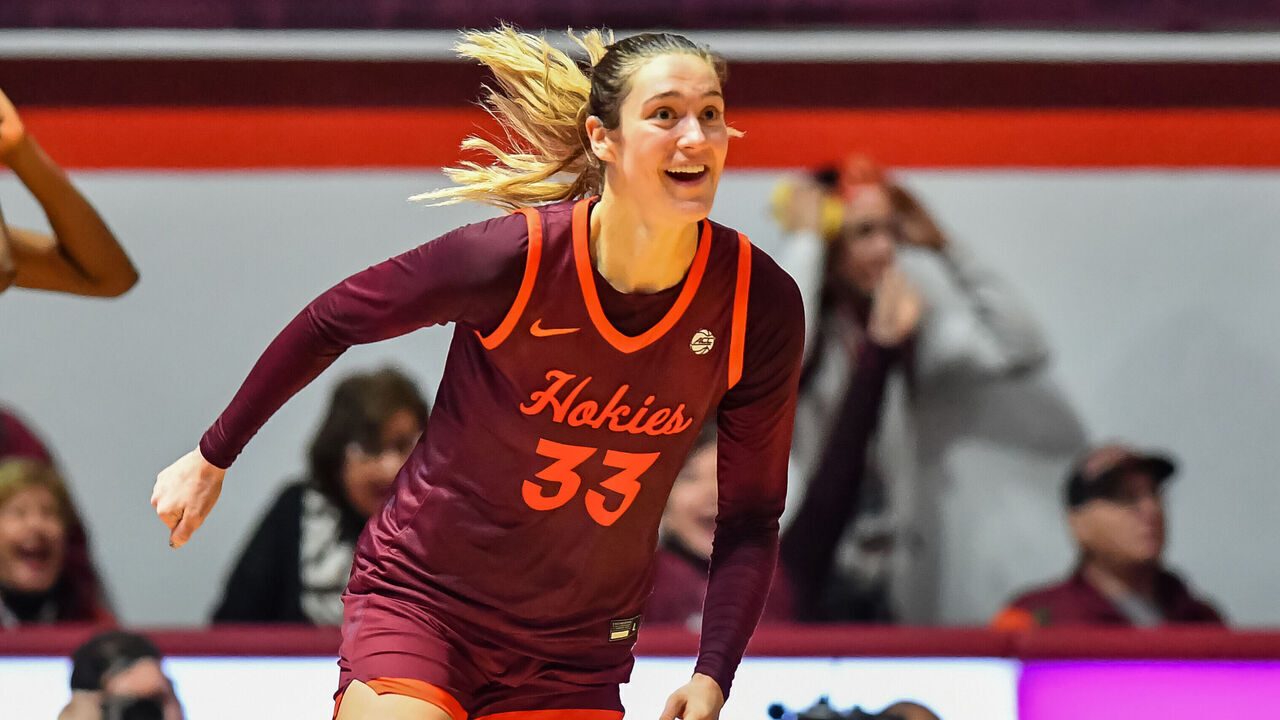 BLACKSBURG, VA - JANUARY 07: Virginia Tech Hokies center Elizabeth Kitley (33) smiles as she runs down the court after hitting the winning shot during a college basketball game between the NC State Wolfpack and the Virginia Tech Hokies on January 7, 2024 at Cassell Coliseum in Blacksburg, VA.