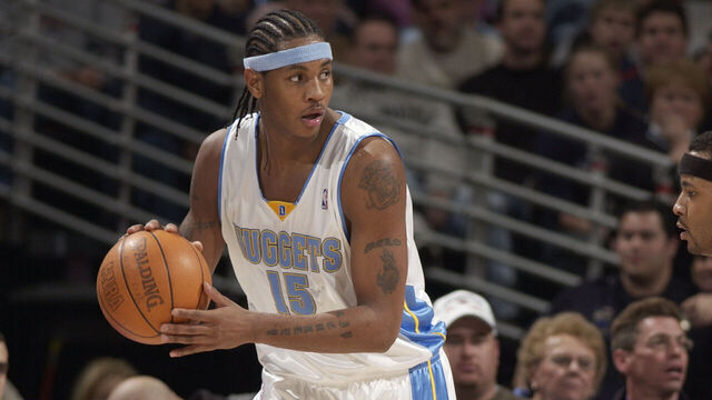 DENVER - DECEMBER 30: Carmelo Anthony #15 of the Denver Nuggets moves the ball against the Toronto Raptors during the game at Pepsi Center on December 30, 2003 in Denver, Colorado. The Raptors won 81-74. NOTE TO USER: User expressly acknowledges and agrees that, by downloading and/or using this Photograph, User is consenting to the terms and conditions of the Getty Images License Agreement.