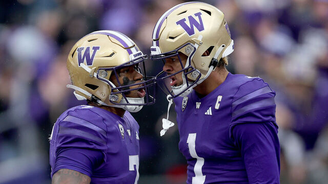 SEATTLE, WASHINGTON - NOVEMBER 11: Dillon Johnson #7 and Rome Odunze #1 of the Washington Huskies celebrate a touchdown against the Utah Utes during the third quarter at Husky Stadium on November 11, 2023 in Seattle, Washington.