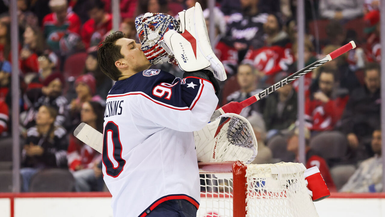NEWARK, NJ - DECEMBER 27: Columbus Blue Jackets goaltender Elvis Merzlikins (90) kisses his mask during a game between the Columbus Blue Jackets and New Jersey Devils on December 27, 2023 at Prudential Center in the Newark, New Jersey.