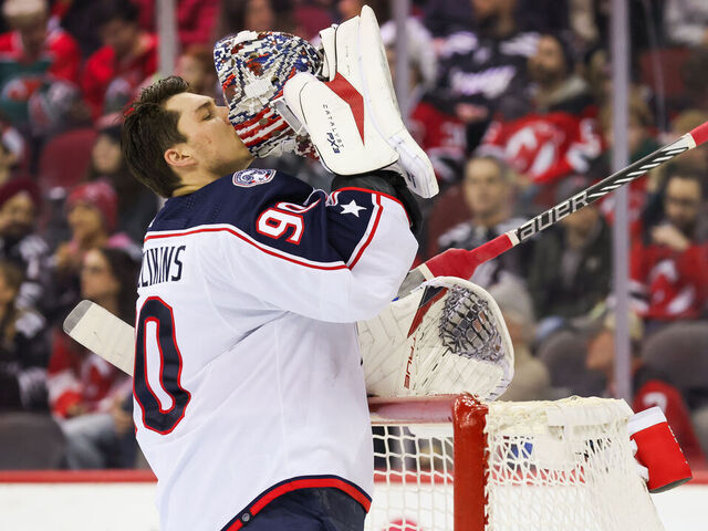 NEWARK, NJ - DECEMBER 27: Columbus Blue Jackets goaltender Elvis Merzlikins (90) kisses his mask during a game between the Columbus Blue Jackets and New Jersey Devils on December 27, 2023 at Prudential Center in the Newark, New Jersey.