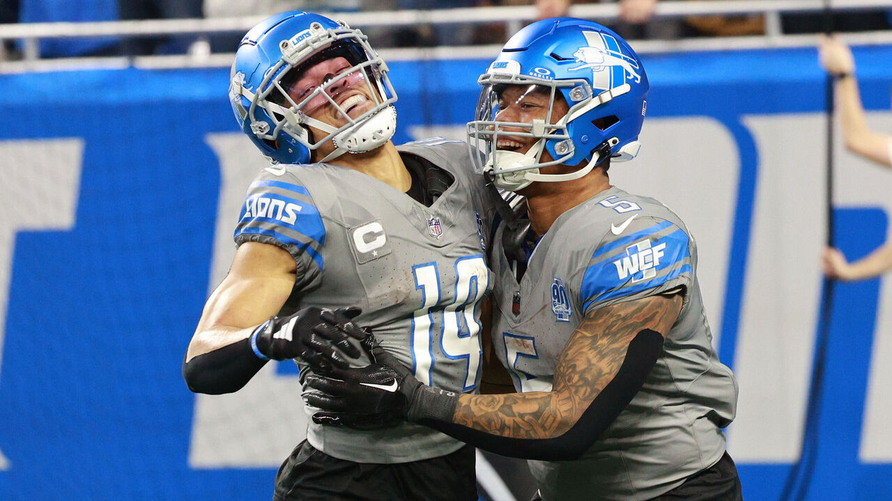 Detroit Lions wide receiver Amon-Ra St. Brown (14) celebrates with running back David Montgomery (5) after scoring a touchdown during the second half of an NFL football game between the Minnesota Vikings and the Detroit Lions in Detroit, Michigan USA, on Sunday, January 7, 2024.