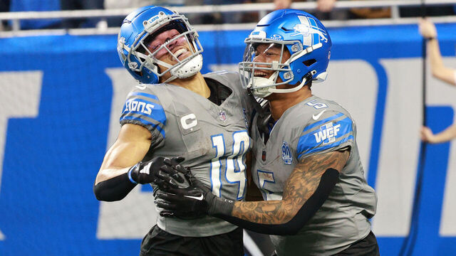 Detroit Lions wide receiver Amon-Ra St. Brown (14) celebrates with running back David Montgomery (5) after scoring a touchdown during the second half of an NFL football game between the Minnesota Vikings and the Detroit Lions in Detroit, Michigan USA, on Sunday, January 7, 2024.