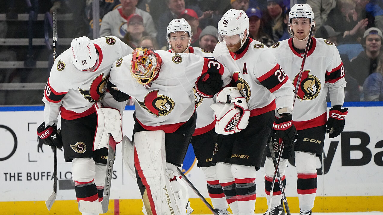 BUFFALO, NY - JANUARY 11: Anton Forsberg #31 of the Ottawa Senators is helped off the ice by teammates after being injured during the first period against the Buffalo Sabres at KeyBank Center on January 11, 2024 in Buffalo, New York.