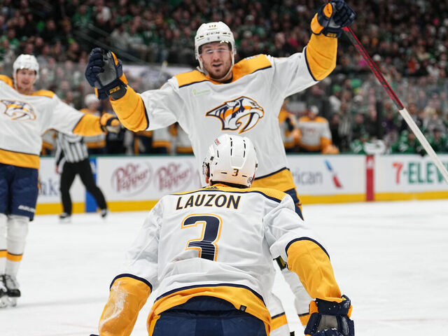 DALLAS, TX - JANUARY 12: Jeremy Lauzon #3 of the Nashville Predators celebrate a goal with team against the Dallas Stars at the American Airlines Center on January 12, 2024 in Dallas, Texas.