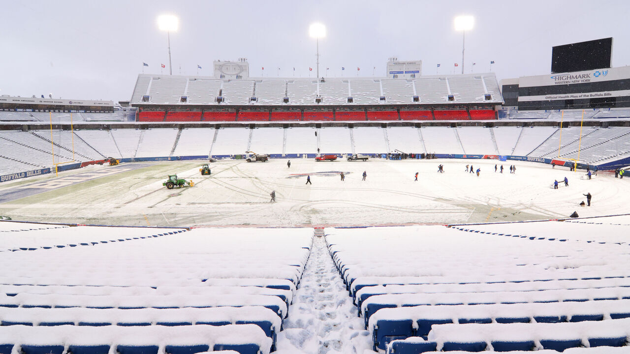 ORCHARD PARK, NY - DECEMBER 17: Ground crews clear snow from the field before a game between the Buffalo Bills and the Miami Dolphins at Highmark Stadium on December 17, 2022 in Orchard Park, New York.