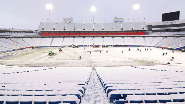 ORCHARD PARK, NY - DECEMBER 17: Ground crews clear snow from the field before a game between the Buffalo Bills and the Miami Dolphins at Highmark Stadium on December 17, 2022 in Orchard Park, New York.