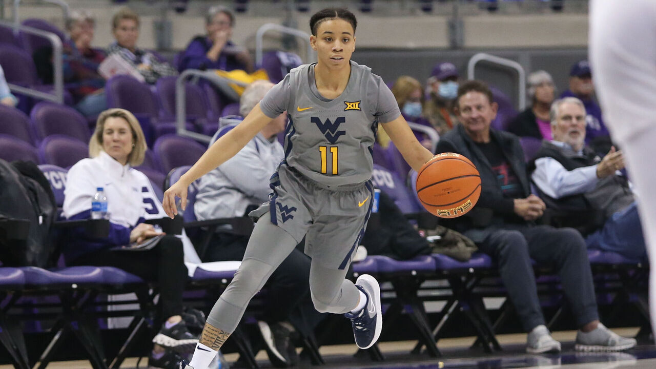 FORT WORTH, TX - FEBRUARY 02: West Virginia Mountaineers guard Ja'Naiya Quinerly (11) drives to the basket during the game between TCU and West Virginia on February 2, 2022 at Ed & Rae Schollmaier Arena in Fort Worth, TX.