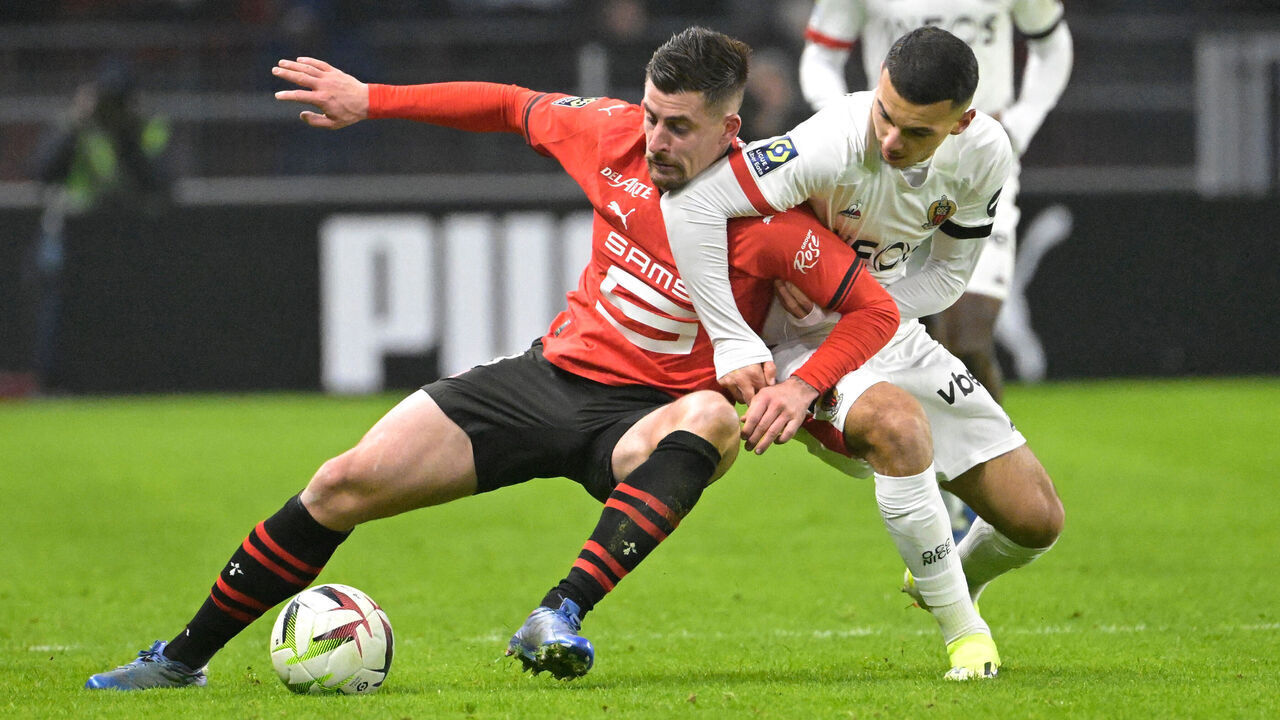 Rennes' French midfielder #08 Baptiste Santamaria (L) fights for the ball with Nice's French forward #22 Badredine Bouanani during the French L1 football match between Stade Rennais FC and OGC Nice at The Roazhon Park Stadium in Rennes, western France on January 13, 2024.