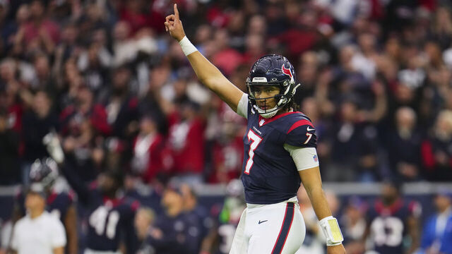 HOUSTON, TX - JANUARY 13: C.J. Stroud #7 of the Houston Texans celebrates after scoring a touchdown against the Cleveland Browns during the first half of the AFC Wild Card playoff game at NRG Stadium on January 13, 2024 in Houston, Texas.