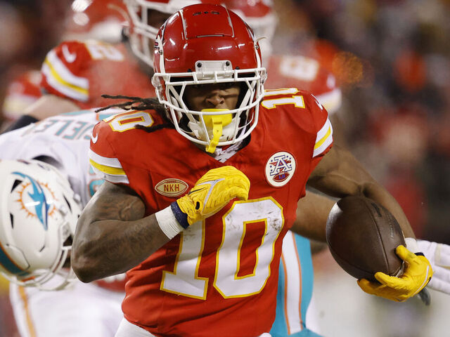 KANSAS CITY, MISSOURI - JANUARY 13: Isiah Pacheco #10 of the Kansas City Chiefs carries the ball during the first half against the Miami Dolphins in the AFC Wild Card Playoffs at GEHA Field at Arrowhead Stadium on January 13, 2024 in Kansas City, Missouri.