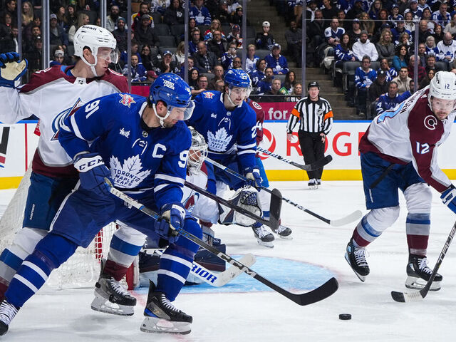 TORONTO, ON - JANUARY 13: John Tavares #91 of the Toronto Maple Leafs battles for the puck against Ryan Johansen #12 of the Colorado Avalanche during the third period at Scotiabank Arena on January 13, 2024 in Toronto, Ontario, Canada.