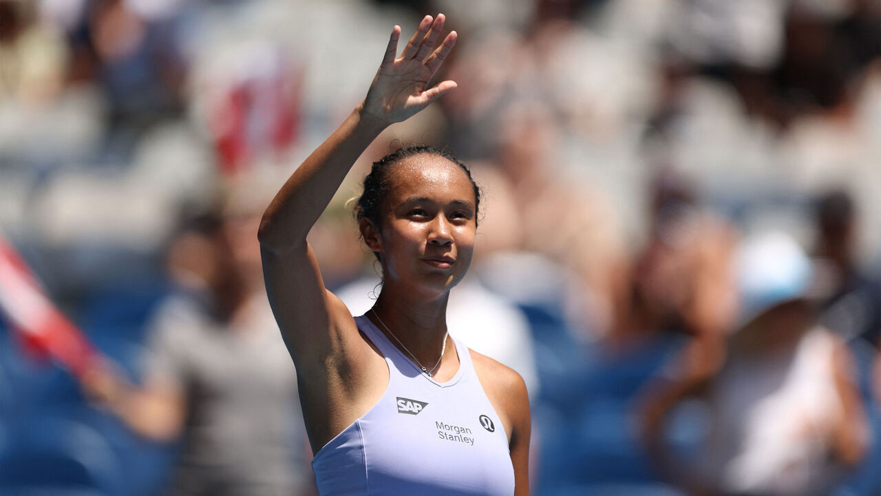 Canada's Leylah Fernandez celebrates after winning against Czech Republic's Sara Bejlek during their women's singles match on day one of the Australian Open tennis tournament in Melbourne on January 14, 2024.