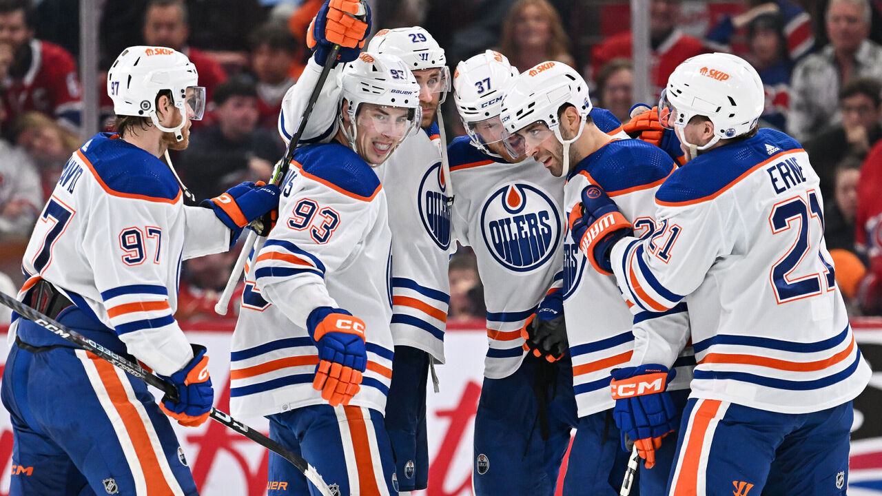 MONTREAL, CANADA - JANUARY 13: Evan Bouchard #2 of the Edmonton Oilers celebrates his overtime goal with teammates Connor McDavid #97, Ryan Nugent-Hopkins #93, Leon Draisaitl #29, Warren Foegele #37 and Adam Erne #21 at the Bell Centre on January 13, 2024 in Montreal, Quebec, Canada. The Edmonton Oilers defeated the Montreal Canadiens 2-1 in overtime.