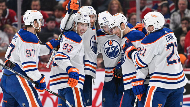 MONTREAL, CANADA - JANUARY 13: Evan Bouchard #2 of the Edmonton Oilers celebrates his overtime goal with teammates Connor McDavid #97, Ryan Nugent-Hopkins #93, Leon Draisaitl #29, Warren Foegele #37 and Adam Erne #21 at the Bell Centre on January 13, 2024 in Montreal, Quebec, Canada. The Edmonton Oilers defeated the Montreal Canadiens 2-1 in overtime.