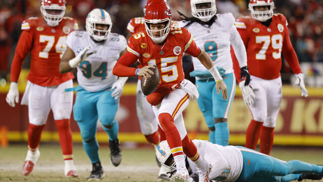 KANSAS CITY, MISSOURI - JANUARY 13: Patrick Mahomes #15 of the Kansas City Chiefs runs with the ball during the first half against the Miami Dolphins in the AFC Wild Card Playoffs at GEHA Field at Arrowhead Stadium on January 13, 2024 in Kansas City, Missouri.
