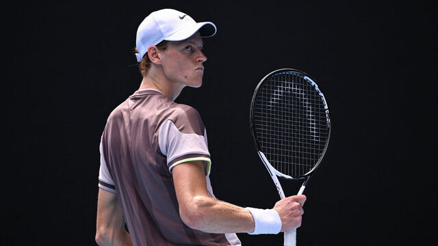 Italy's Jannik Sinner reacts after a point against Netherlands' Botic van de Zandschulp during their men's singles match on day one of the Australian Open tennis tournament in Melbourne on January 14, 2024.