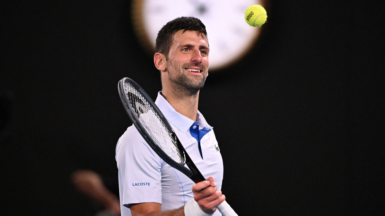 Serbia's Novak Djokovic reacts between points against Croatia's Dino Prizmic during their men's singles match on day one of the Australian Open tennis tournament in Melbourne on January 14, 2024.