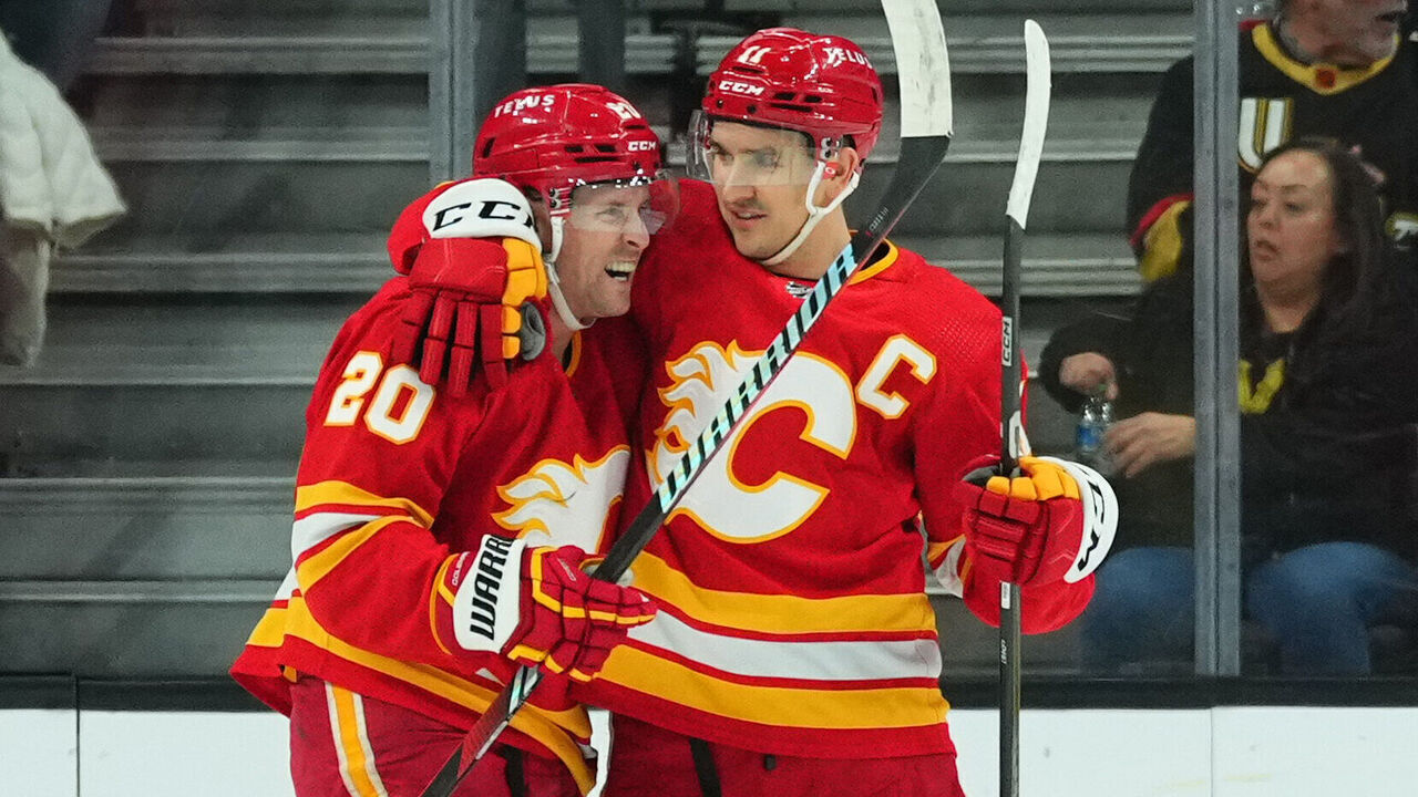 LAS VEGAS, NEVADA - JANUARY 13: Blake Coleman #20 of the Calgary Flames celebrates with teammates after a goal during the first period against the Vegas Golden Knights at T-Mobile Arena on January 13, 2024 in Las Vegas, Nevada.