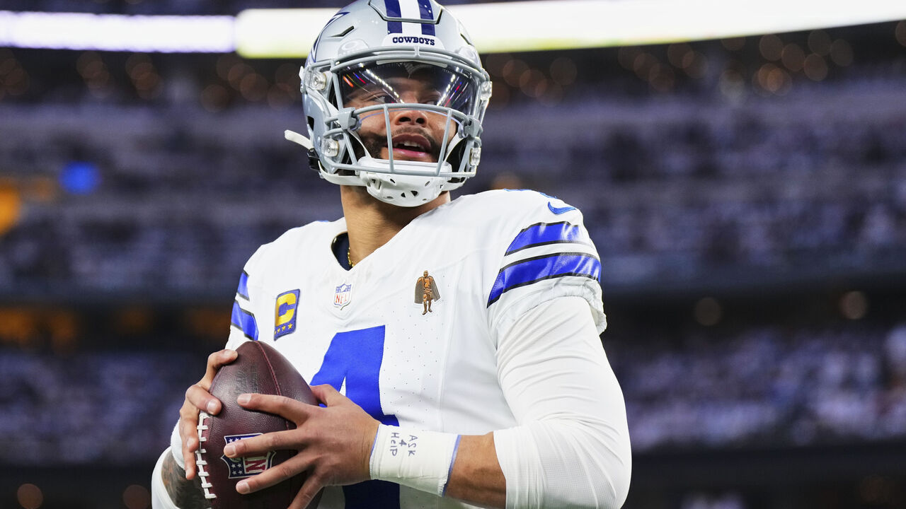 DALLAS, TX - JANUARY 14: Dak Prescott #4 of the Dallas Cowboys warms up before kickoff against the Green Bay Packers during the NFC Wild Card playoff game at AT&T Stadium on January 14, 2024 in Dallas, Texas.