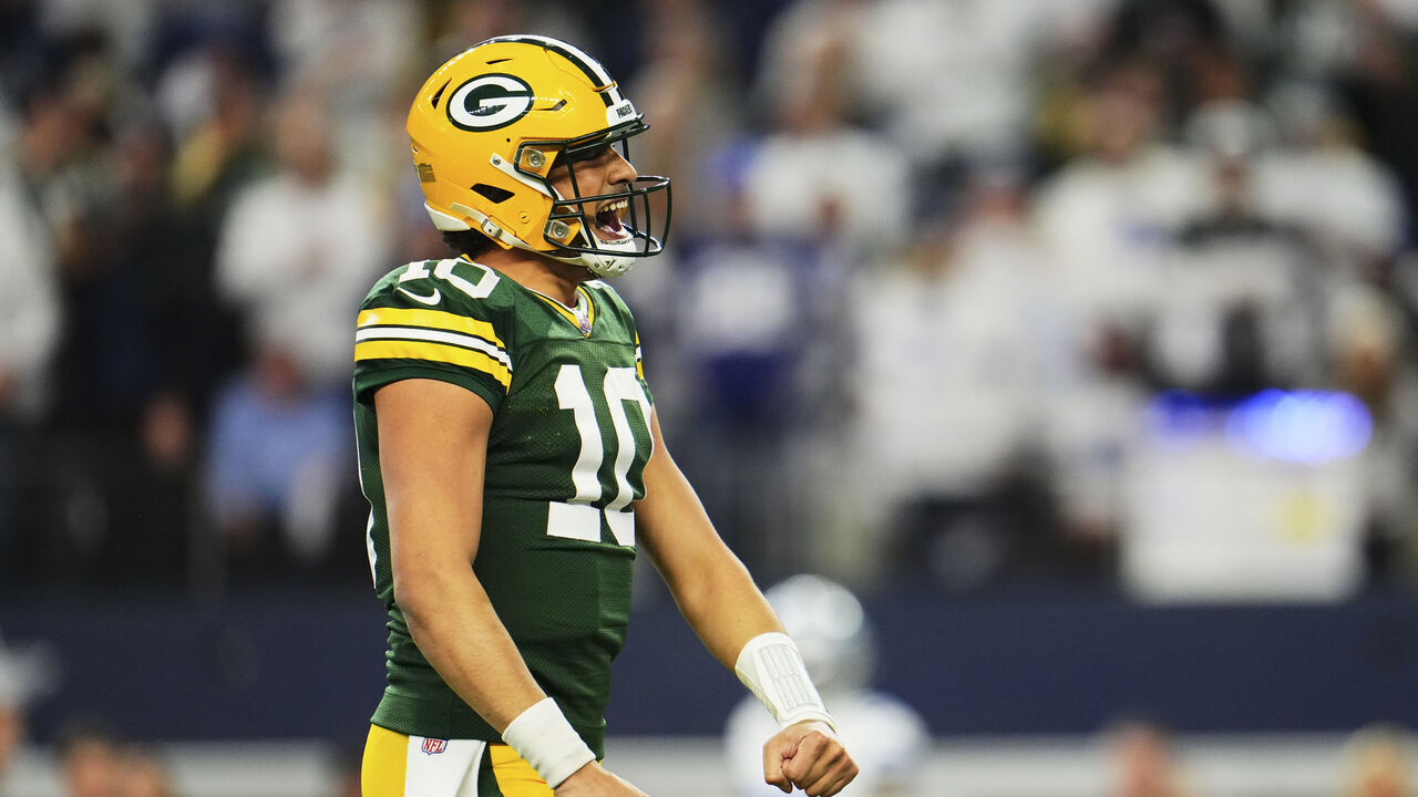 DALLAS, TX - JANUARY 14: Jordan Love #10 of the Green Bay Packers celebrates after scoring a touchdown against the Dallas Cowboys during the first half of the NFC Wild Card playoff game at AT&T Stadium on January 14, 2024 in Dallas, Texas.