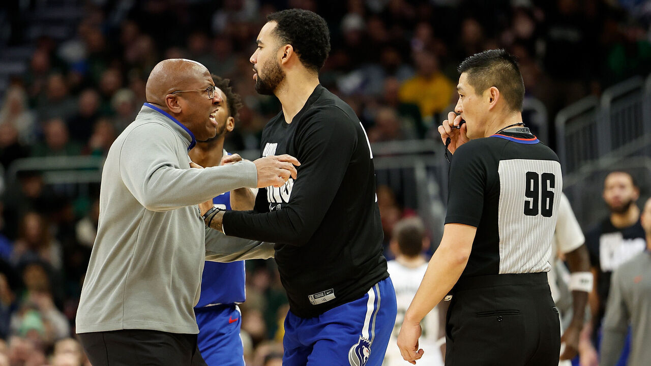 MILWAUKEE, WISCONSIN - JANUARY 14: Head coach Mike Brown of the Sacramento Kings charges after referee Intae Hwang #96 during the second half of the game against the Milwaukee Bucks at Fiserv Forum on January 14, 2024 in Milwaukee, Wisconsin.