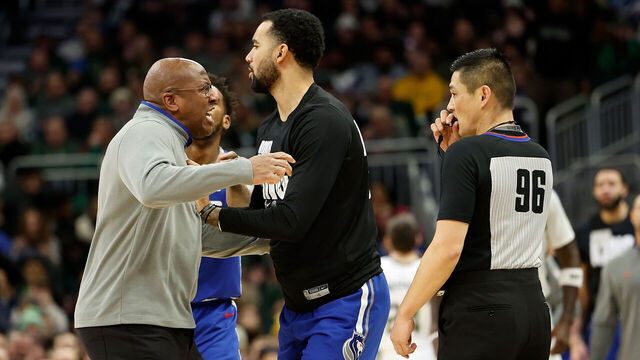 MILWAUKEE, WISCONSIN - JANUARY 14: Head coach Mike Brown of the Sacramento Kings charges after referee Intae Hwang #96 during the second half of the game against the Milwaukee Bucks at Fiserv Forum on January 14, 2024 in Milwaukee, Wisconsin.