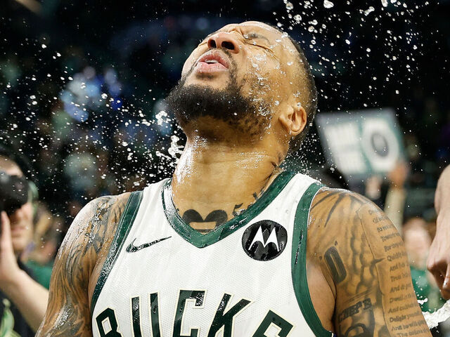 MILWAUKEE, WISCONSIN - JANUARY 14: Damian Lillard #0 of the Milwaukee Bucks reacts after getting water dumped over him celebrating his game winning shot against the Sacramento Kings at Fiserv Forum on January 14, 2024 in Milwaukee, Wisconsin.