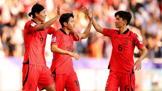 DOHA, QATAR - JANUARY 15: Lee Kang-In of South Korea celebrates scoring their third goal with Cho Gue-Sung and Hwang In-Beom during the AFC Asian Cup Group E match between South Korea and Bahrain at Jassim Bin Hamad Stadium on January 15, 2024 in Doha, Qatar.