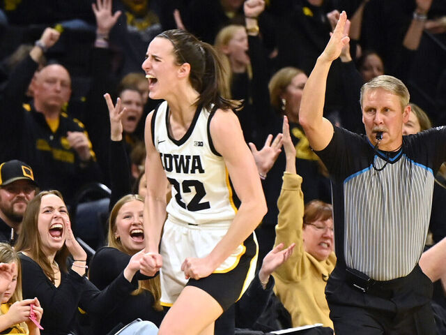 IOWA CITY, IA - JANUARY 13: Iowa guard Caitlin Clark (22) reacts after hitting a three-point shot during a college women's basketball game between the Indiana Hoosiers and the Iowa Hawkeyes on January 13, 2024, at Carver-Hawkeye Arena in Iowa City, IA.