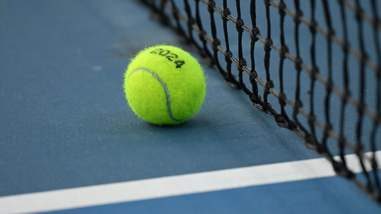 MELBOURNE, AUSTRALIA - JANUARY 14: A detailed view of a tennis ball on court during day one of the 2024 Australian Open at Melbourne Park on January 14, 2024 in Melbourne, Australia.
