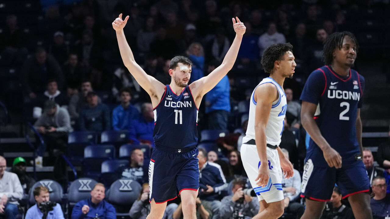 CINCINNATI, OHIO - JANUARY 10: Alex Karaban #11 of the Connecticut Huskies celebrates after beating the Xavier Musketeers 80-75 at Cintas Center on January 10, 2024 in Cincinnati, Ohio.