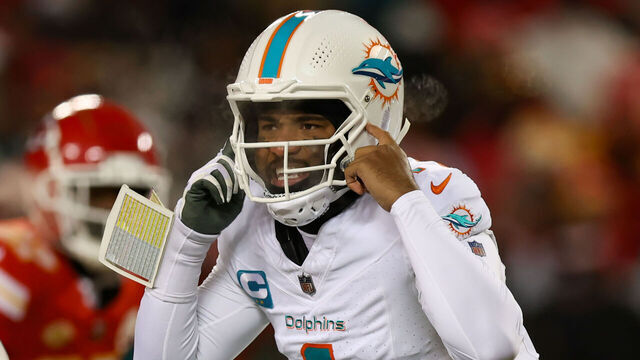 KANSAS CITY, MO - JANUARY 13: Miami Dolphins quarterback Tua Tagovailoa (1) points to his helmet before the snap in the first quarter of an AFC Wild Card playoff game between the Miami Dolphins and Kansas City Chiefs on Jan 13, 2024 at GEHA Field at Arrowhead Stadium in Kansas City, MO.