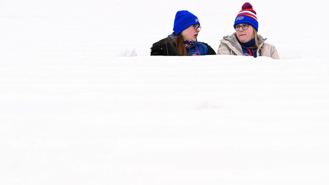 ORCHARD PARK, NY - JANUARY 15: Fans sit in the snow filled seats prior to the NFL wild-card playoff football game between the Pittsburgh Steelers and Buffalo Bills at Highmark Stadium on January 15, 2024 in Orchard Park, New York.