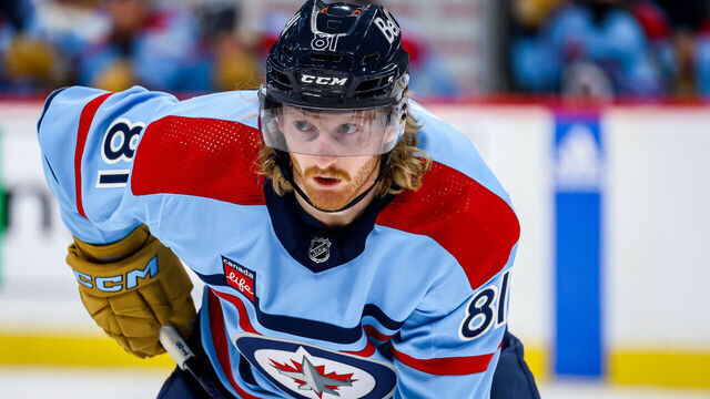 WINNIPEG, CANADA - DECEMBER 4: Kyle Connor #81 of the Winnipeg Jets looks on during a second period face-off against the Carolina Hurricanes at the Canada Life Centre on December 4, 2023 in Winnipeg, Manitoba, Canada.