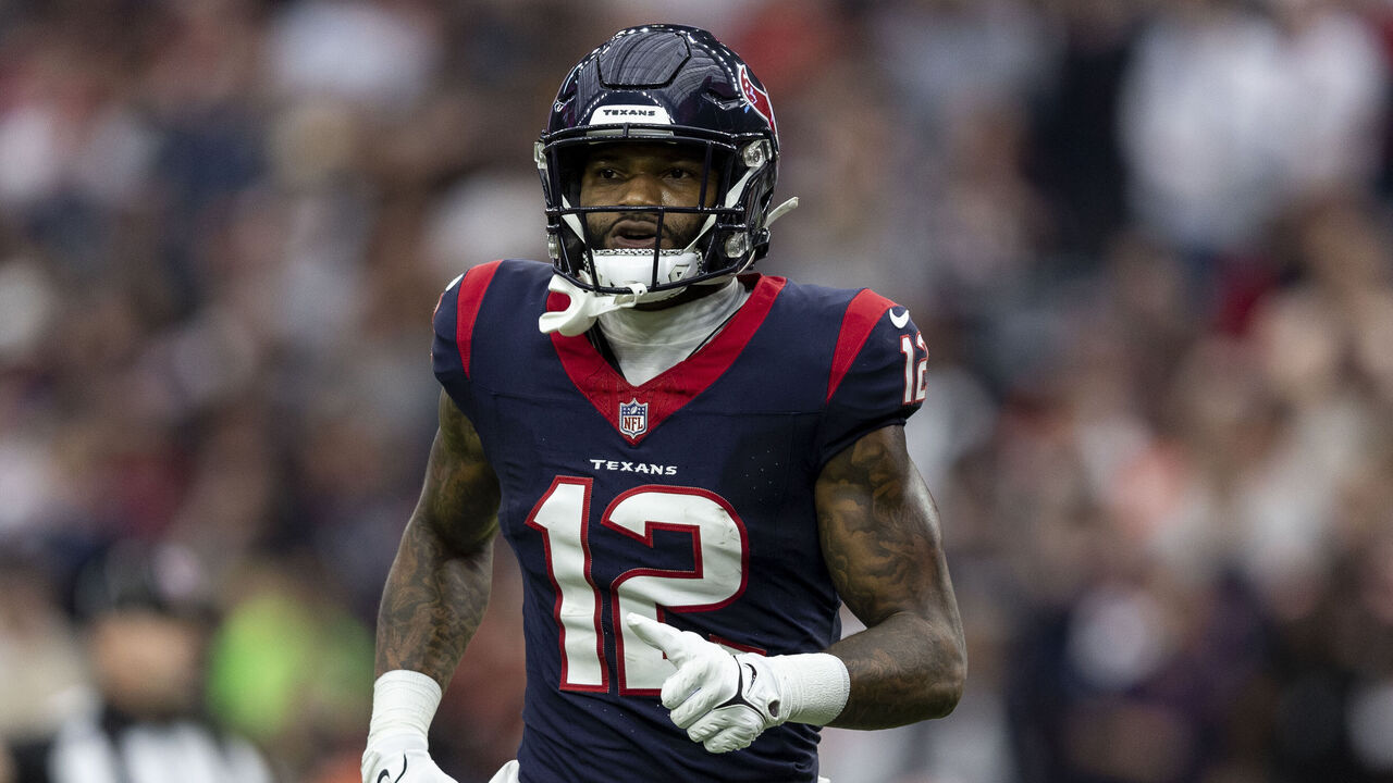 HOUSTON, TEXAS - JANUARY 13: Nico Collins #12 of the Houston Texans runs during an NFL wild-card playoff football game between the Houston Texans and the Cleveland Browns at NRG Stadium on January 13, 2024 in Houston, Texas.