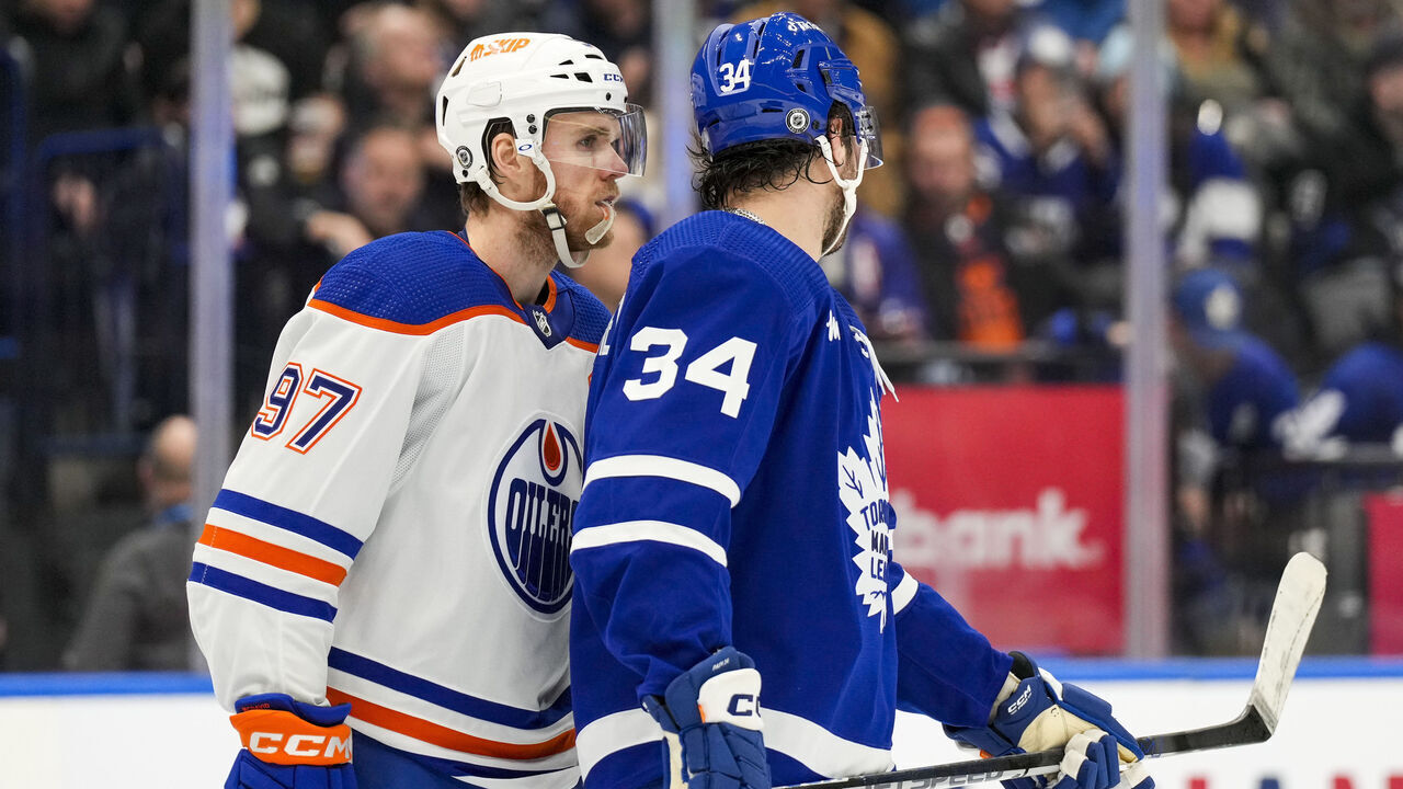 TORONTO, ON - MARCH 11: Connor McDavid #97 of the Edmonton Oilers skates along Auston Matthews #34 of the Toronto Maple Leafs during the second period at the Scotiabank Arena on March 11, 2023 in Toronto, Ontario, Canada.