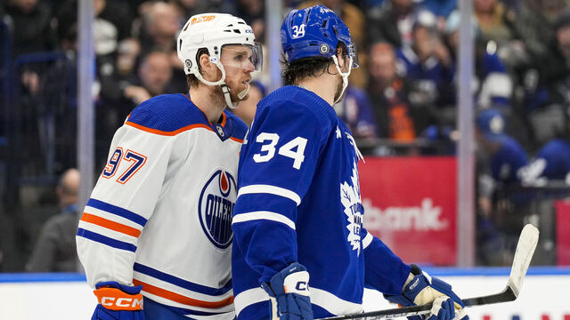 TORONTO, ON - MARCH 11: Connor McDavid #97 of the Edmonton Oilers skates along Auston Matthews #34 of the Toronto Maple Leafs during the second period at the Scotiabank Arena on March 11, 2023 in Toronto, Ontario, Canada.