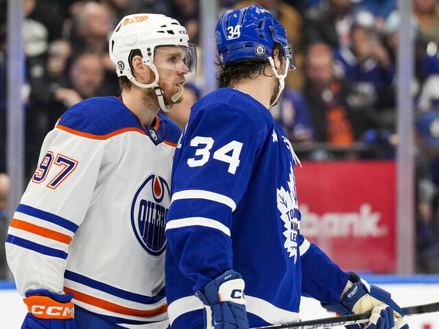 TORONTO, ON - MARCH 11: Connor McDavid #97 of the Edmonton Oilers skates along Auston Matthews #34 of the Toronto Maple Leafs during the second period at the Scotiabank Arena on March 11, 2023 in Toronto, Ontario, Canada.