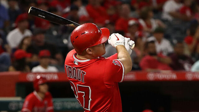 ANAHEIM, CA - SEPTEMBER 29: Mike Trout #27 of the Los Angeles Angels of Anaheim follows through on his swing for a solo homerun during the first inning of the MLB game against the Seattle Mariners at Angel Stadium of Anaheim on September 29, 2017 in Anaheim, California. The homerun was Trout's 200th career homerun. The Angels defeated the Mariners 6-5.