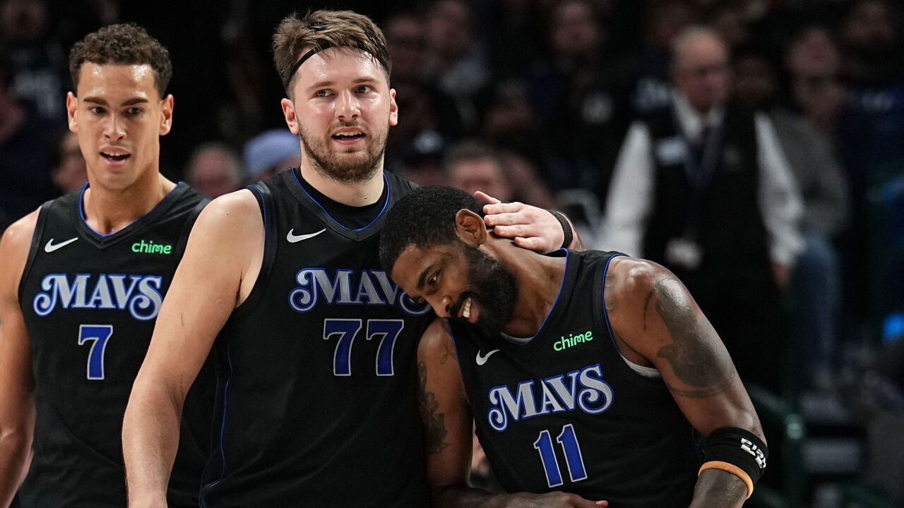 DALLAS, TX - DECEMBER 6 : Luka Doncic #77 embraces Kyrie Irving #11 of the Dallas Mavericks during the game against the Utah Jazz on December 6, 2023 at the American Airlines Center in Dallas, Texas. Mandatory Copyright Notice: Copyright 2023 NBAE
