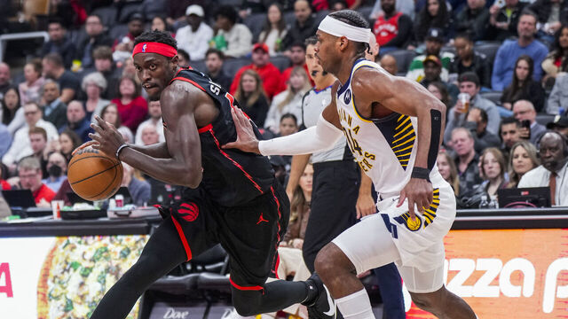 TORONTO, ON - MARCH 22: Pascal Siakam #43 of the Toronto Raptors drives against Buddy Hield #24 of the Indiana Pacers during the second half of their basketball game at the Scotiabank Arena on March 22, 2023 in Toronto, Ontario, Canada. NOTE TO USER: User expressly acknowledges and agrees that, by downloading and/or using this Photograph, user is consenting to the terms and conditions of the Getty Images License Agreement.