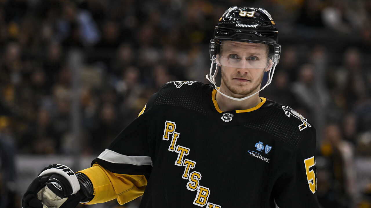 PITTSBURGH, PA - JANUARY 11: Pittsburgh Penguins left wing Jake Guentzel (59) looks on during the second period in the NHL game between the Pittsburgh Penguins and the Vancouver Canucks on January 11, 2024, at PPG Paints Arena in Pittsburgh, PA.